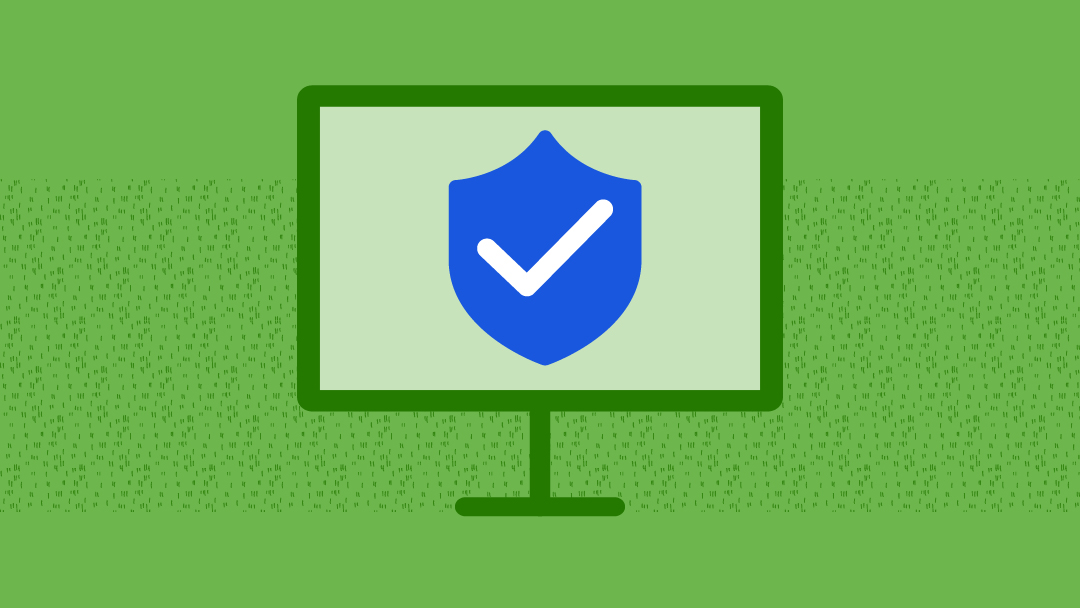 A computer that has a blue shield with a white checkmark in the center